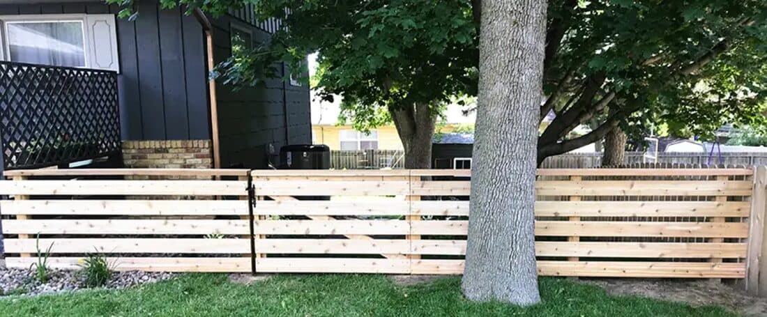 Extraordinaire Fence - Horizontal Deck Board install in Sioux Falls