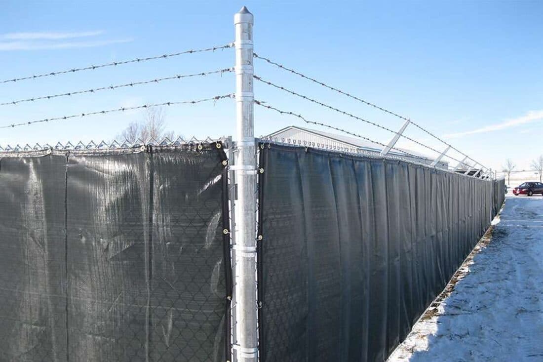 Extraordinaire Fence - Commercial Privacy Slats install in Sioux Falls