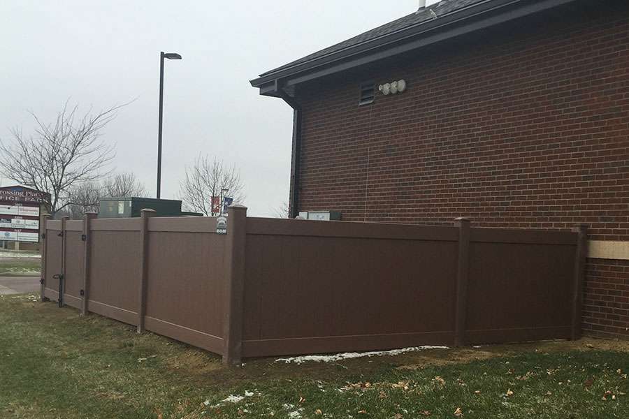 Extraordinaire Fence - Commercial Vinyl Enclosure install in Sioux Falls